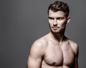 Muscular man maintains his appearance with minor cosmetic touch-ups.