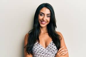 Beautiful woman in her early 40s feels confident in her clothing after a breast lift.