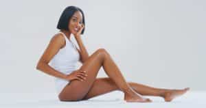 Pretty African American woman has a nice figure after removing stubborn fat with liposuction.